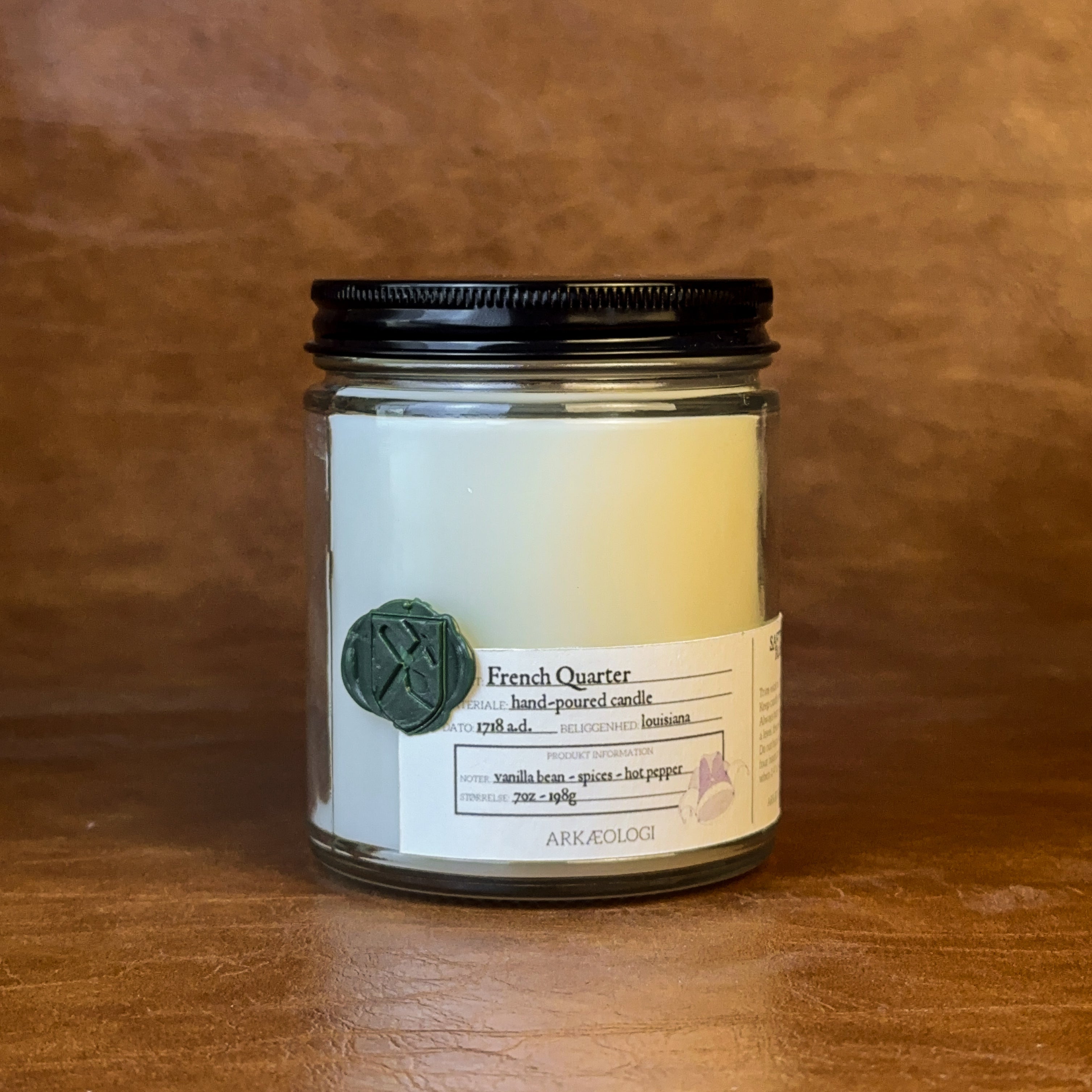 French Quarter candle jar with black lid on map background