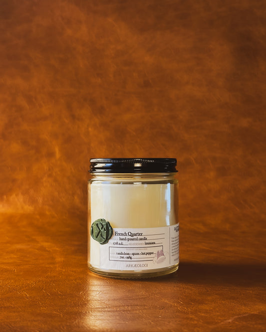 French Quarter candle jar with black lid on map background