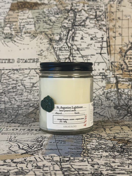 Saint Augustine Lighthouse candle with black lid on map background